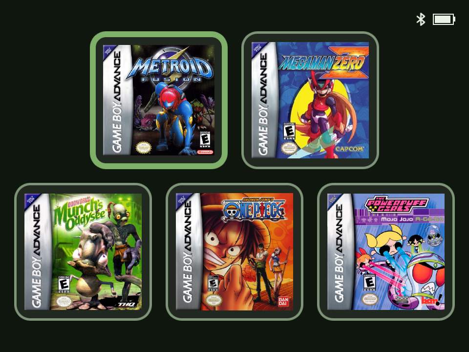 The 5-Game Mode focus screen: five Game Boy Advance box-art tiles laid out two on top and three below, the top-left tile highlighted with a brighter accent border, and a small battery and Bluetooth icon in the top corner