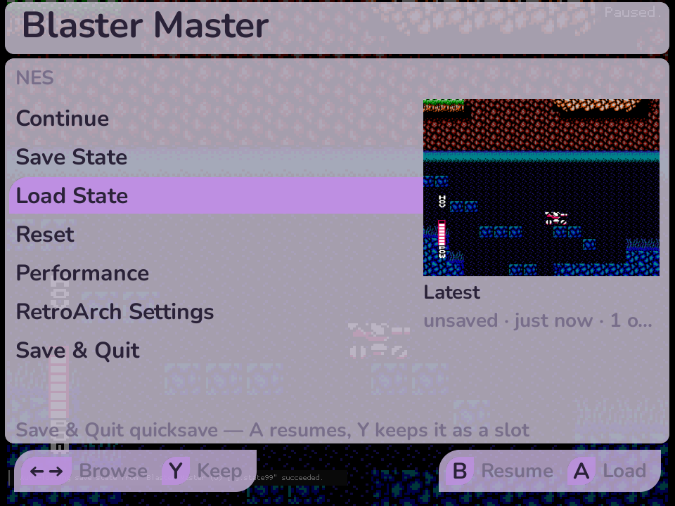 The in-game menu over a paused game, with a save-state thumbnail and button hints